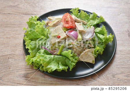 glass noodles with Vietnamese sausage and chop pork spicy salad on plate glass noodles with Vietnamese sausage and chop pork spicy salad on plate 85295206