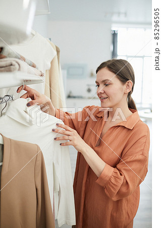 Woman buying new clothes in the store 85296505