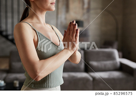 Woman meditating in the morning alone Woman meditating in the morning alone 85296575