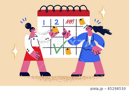Smiling businesswomen plan tasks on board Smiling businesswomen plan tasks on board 85298530