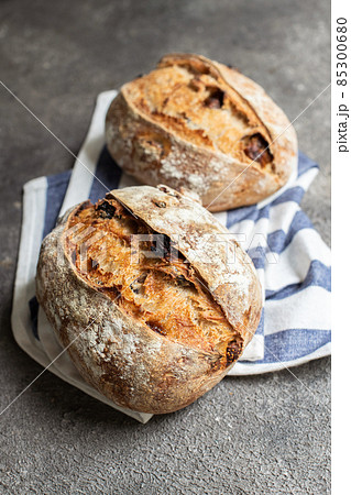 Freshly baked sourdough bread with dried tomatoes. Freshly baked sourdough bread with dried tomatoes. 85300680
