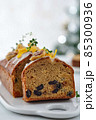 Beautiful delicious homemade Christmas dried fruit cake on grey table with decorating items for celebrating festive season. 85300936