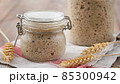 Active rye sourdough starter in a jar. Copy space. 85300942