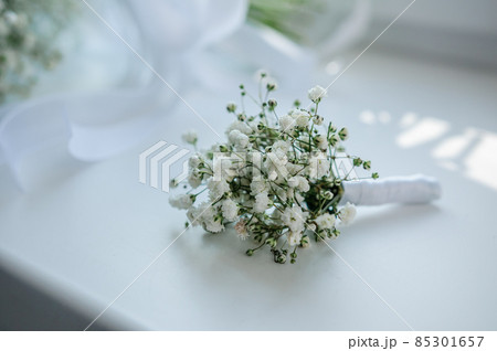Groom boutonniere on white background Groom boutonniere on white background 85301657