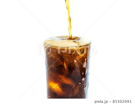 Solt drink being poures into a glass with ice Solt drink being poures into a glass with ice 85302091