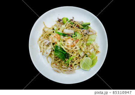 Die cut of spaghetti seafood on black background. 85310947