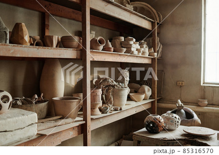 Image of different ceramic vases on the shelves in the workshop 85316570