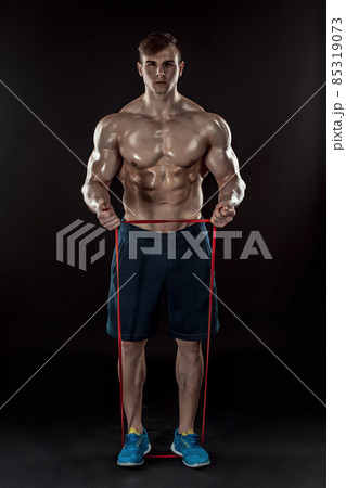Young athletic man exercising and doing fitness 85319073