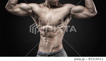 Fitness man model torso posing and showing perfect body Fitness man model torso posing and showing perfect body 85319411