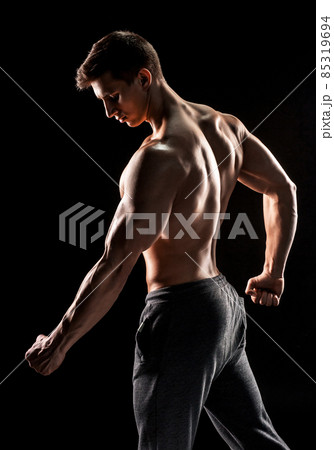 Strong man showing perfect abs, houlders, biceps, triceps and ch Strong man showing perfect abs, houlders, biceps, triceps and ch 85319694