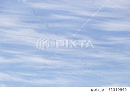 Texture white cirrus clouds on the background blue sky. Texture white cirrus clouds on the background blue sky. 85319946