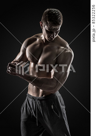 Sporty healthy man posing and showing his perfect boddy 85322256