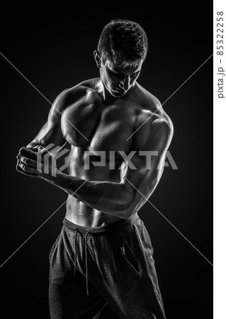 Sporty healthy man posing and showing his perfect boddy 85322258