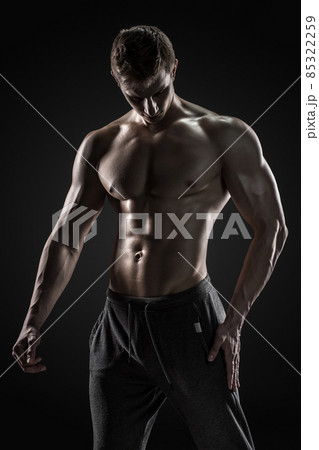Sporty healthy man posing and showing his perfect boddy 85322259