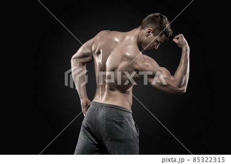 Healthy muscular man on showing perfect biceps, triceps, rear view Healthy muscular man on showing perfect biceps, triceps, rear view 85322315