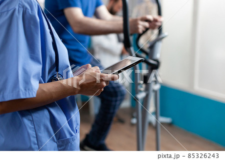 Close up of nurse holding digital tablet with touch screen 85326243