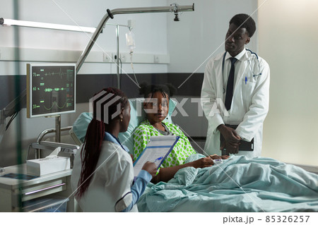 African american physician doctor discussing medication treatment with patient African american physician doctor discussing medication treatment with patient 85326257