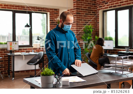 Executive manager with medical protection face mask to against covid19 Executive manager with medical protection face mask to against covid19 85326263
