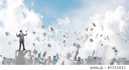 Businessman standing with megaphone. Businessman standing with megaphone. 85331631