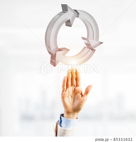 Web refresh icon and male hands as symbol for internet use. Mixed media Web refresh icon and male hands as symbol for internet use. Mixed media 85331632