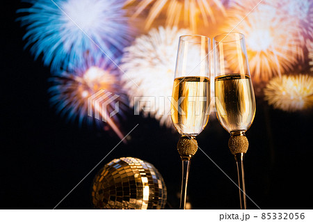 happy New Year champagne glasses and fireworks celebration background 85332056