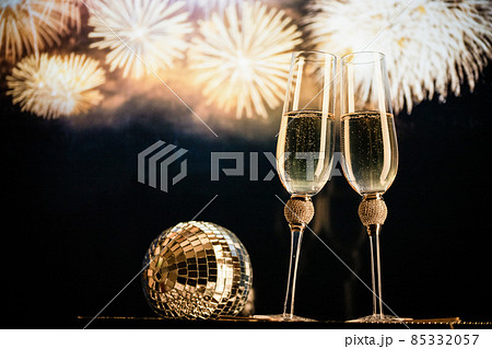 happy New Year champagne glasses and fireworks celebration background 85332057