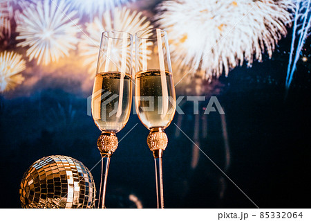 happy New Year champagne glasses and fireworks celebration background 85332064