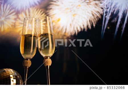 happy New Year champagne glasses and fireworks celebration background 85332066