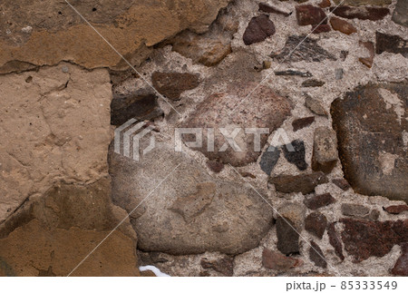 Yellow orange warm sandstone limestone wall abstract background texture 85333549