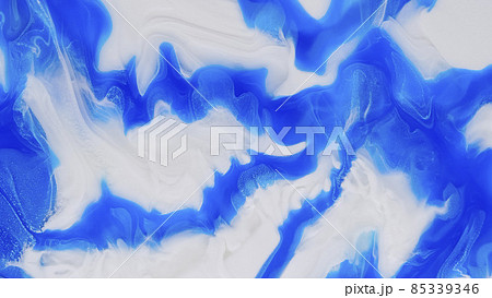 Blue streaks on a white background. Liquid abstractions. Abstract natural art. Blue streaks on a white background. Liquid abstractions. Abstract natural art. 85339346