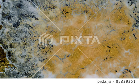 Marble texture of white and gold color. Luxurious abstract fluid art painting on the background of the technique of alcohol ink in black and gold colors. Marble texture of white and gold color. Luxurious abstract fluid art painting on the background of the technique of alcohol ink in black and gold colors. 85339351