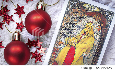 Tarot cards in Christmas decoration. Esoteric, fortune telling and predictions Tarot cards in Christmas decoration. Esoteric, fortune telling and predictions 85345425