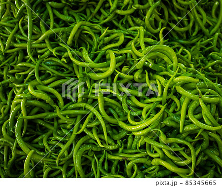 Close-up on a shelf with green peppers in the market. Close-up on a shelf with green peppers in the market. 85345665