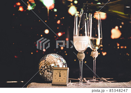 happy New Year champagne glasses and fireworks celebration background 85348247
