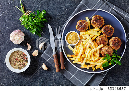 Vitoulet, hot Belgian meatballs with french fries 85348687