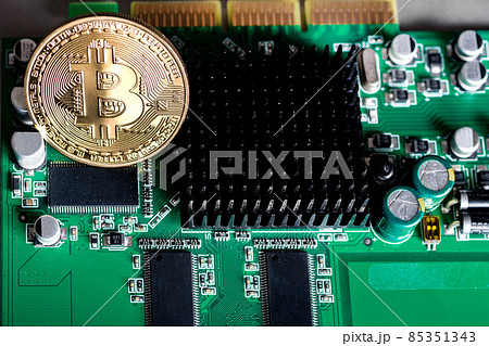 gold coin bitcoin on an electronic Board gold coin bitcoin on an electronic Board 85351343