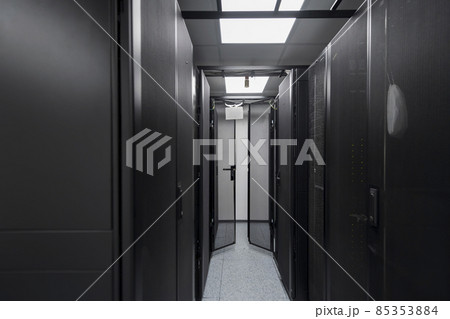 Data Center With Multiple Rows of Fully Operational Server Racks. Modern Telecommunications, Cloud Computing, Artificial Intelligence, Database, Supercomputer Technology Concept. Data Center With Multiple Rows of Fully Operational Server Racks. Modern Telecommunications, Cloud Computing, Artificial Intelligence, Database, Supercomputer Technology Concept. 85353884