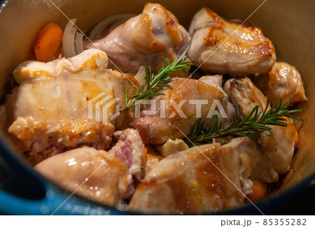 Rabbit casserole recipe with olives and herbs, sauteed potatoes 85355282