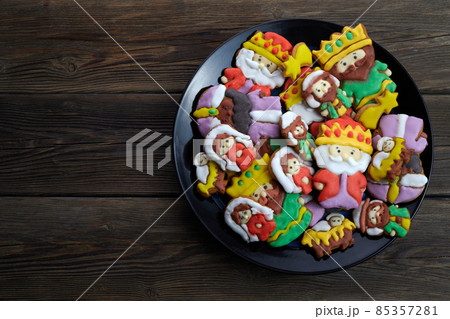 Happy Epiiphany day. Homemade cookies in the shape of the three wise men on wooden background. Happy Epiiphany day. Homemade cookies in the shape of the three wise men on wooden background. 85357281