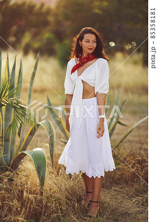 Woman in Elegant Summer Outfit Outdoors Near Aloe Vera 85358181