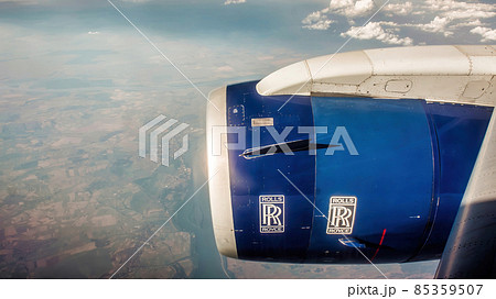 Rolls Royce logo on an airplane engine, flying above clouds Rolls Royce logo on an airplane engine, flying above clouds 85359507