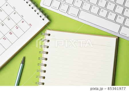 Open blank diary and desk calendar with computer keyboard. Open blank diary and desk calendar with computer keyboard. 85361977