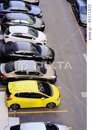 Colorful car parking lot inn modern condo resident aerial view 85371920
