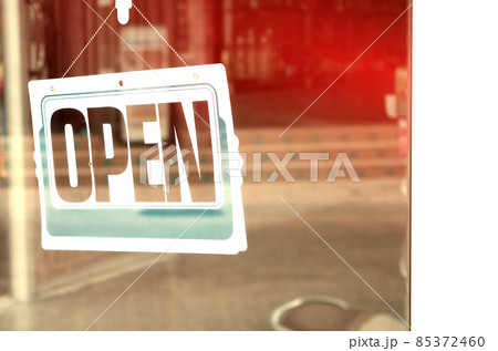 Open sign hanging front of cafe with colorful bokeh light abstract background. Open sign hanging front of cafe with colorful bokeh light abstract background. 85372460