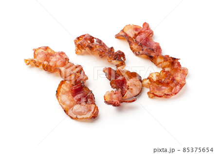 Cooked fried slices of bacon isolated 85375654