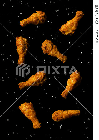 Fried chicken legs flying isolated Fried chicken legs flying isolated 85375688