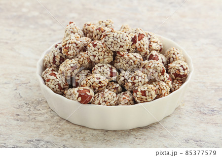 Sweet peanut in sesame seeds Sweet peanut in sesame seeds 85377579