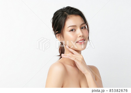 Beautiful young asian woman with clean fresh skin on white background, Face care, Facial treatment 85382676
