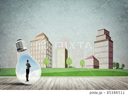 Businesswoman trapped in bulb 85386511