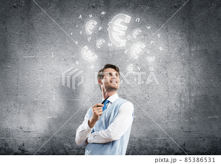 Elegant handsome businessman against concrete wall with pipe in Elegant handsome businessman against concrete wall with pipe in 85386531